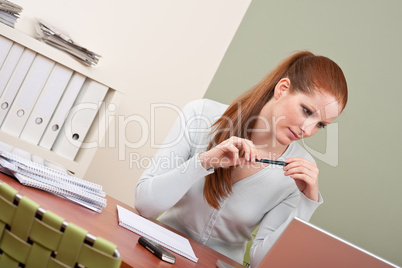 Long red hair  business woman with laptop