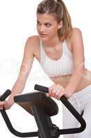 Fitness series - Young woman on exercise bike