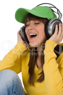 Happy female teenager enjoy music