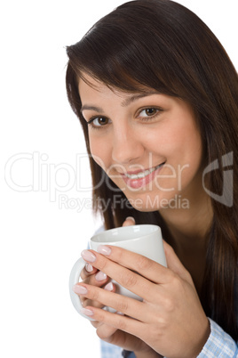 Happy young woman with coffee in pajamas