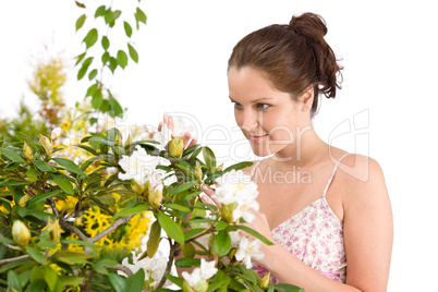 Gardening - Woman with Rhododendron flower blossom