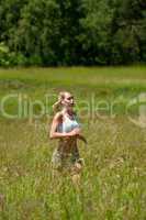 Young woman jogging in a meadow