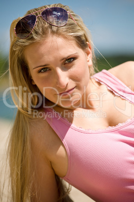 Beautiful blond woman on sunny beach