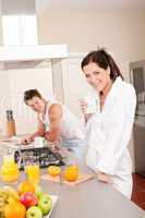 Happy couple having breakfast in the kitchen