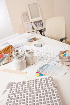 Office of interior designer with paint and color swatch