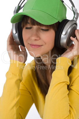 Female teenager enjoy music with headphones