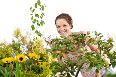 Gardening - Woman with Rhododendron flower blossom