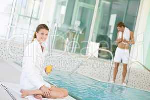 Swimming pool - young woman relax on poolside
