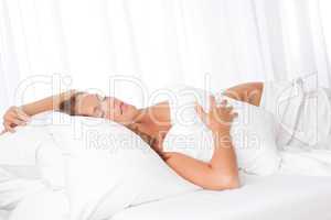 White lounge - Young woman sleeping in bed