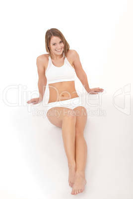 Fitness - Young happy woman relaxing after training