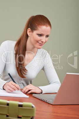 Long red hair business woman at office