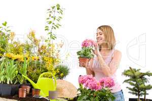 Gardening - Happy woman holding flower pot