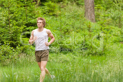 Morning run: Young man jogging in nature