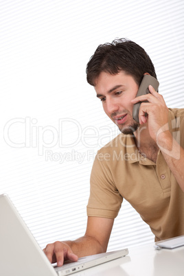 Successful modern businessman with phone