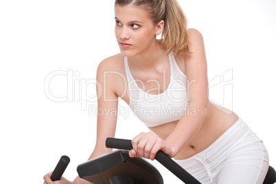 Fitness series - Young woman with exercise bike