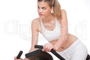 Fitness series - Young woman with exercise bike