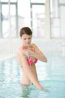 Swimming pool - beautiful woman in bikini
