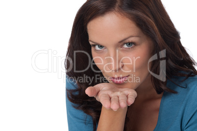 Brown hair woman blowing a kiss
