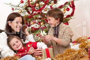 Happy family: mother with son and daughter