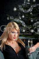 Portrait of blond sexy woman with glass of champagne
