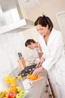 Young woman preparing breakfast in the kitchen