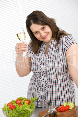 Cook - Plus size woman with white wine and salad