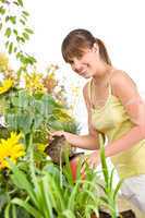 Gardening - smiling woman holding flower pot