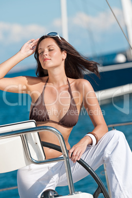 Young woman sailing on luxury yacht