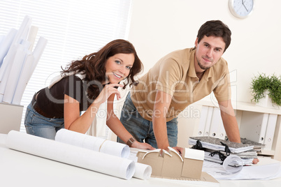 Young man and woman working at architect office