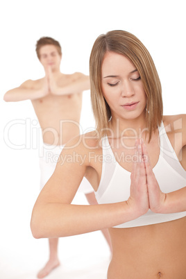 Fitness - Healthy couple stretchin in yoga position