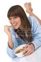 Female teenager eat healthy  cereal for breakfast