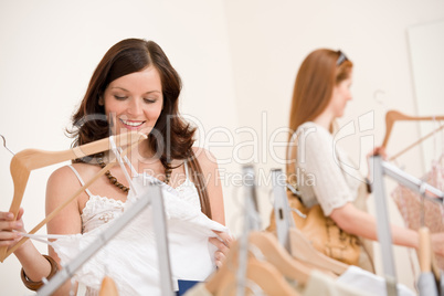Fashion shopping -  Two happy young woman choose clothes