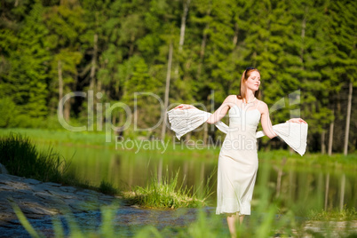 Beautiful romantic woman in summer sunny nature