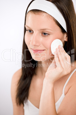 Facial care - woman removing make-up