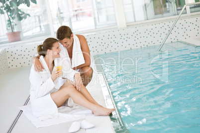 Swimming pool - young happy couple relax