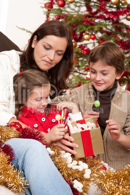 Happy family: mother with son and daughter