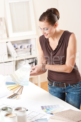 Young female designer working at office