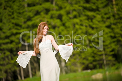 Beautiful romantic woman in summer sunny nature