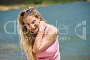 Happy blond woman enjoy summer sun