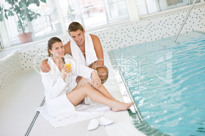 Swimming pool - young happy couple relax