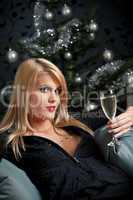Portrait of blond sexy woman with glass of champagne