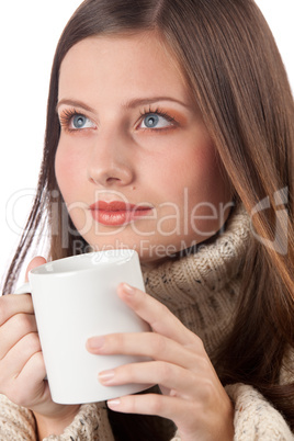 Winter portrait of happy woman holding cup of coffee