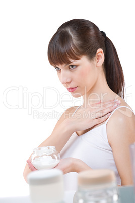Body care: Beautiful woman applying cream