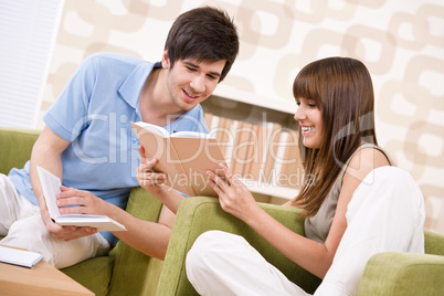 Student - two teenager reading book in lounge