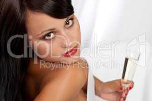 Portrait of sexy woman holding glass of champagne