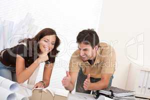 Man and woman at architect office working