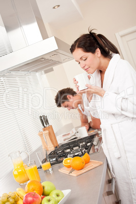 Young woman drinking coffee in the kitchen