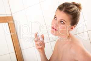 Body care series - Young woman applying perfume