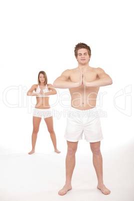 Fitness - Healthy couple stretchin in yoga position