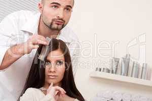 Professional hairdresser choose hair dye color at salon